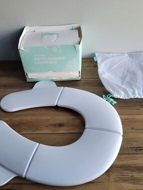 Frida Baby Potty Training Fold N Go Potty Seat Cover And 10 Mess Mats Disposable